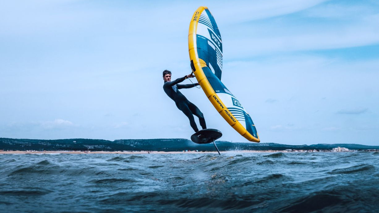 Mathis Ghio wingfoiling on the water using Ocean Rodeo kit